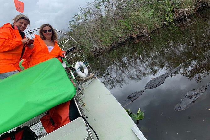 60 Minute Small Group Semi Private Everglades River Of Grass Airboat Charter - A small airboat on Florida’s River of Grass