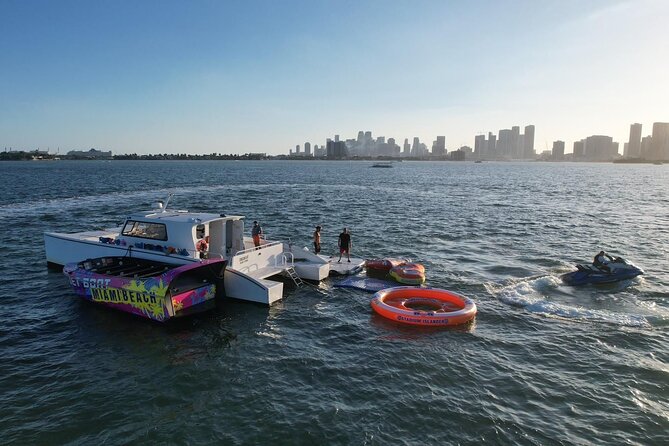 Aquatic Adventure: Boat Tour with Jetskis, Tubing, and Open Bar - 360 tubing and the water mat