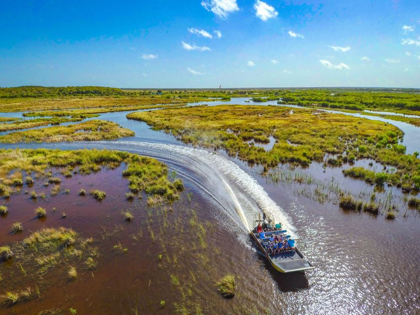 Everglades City: Guided Kayaking Tour and Airboat Ride - Paddling into the mangrove tunnels