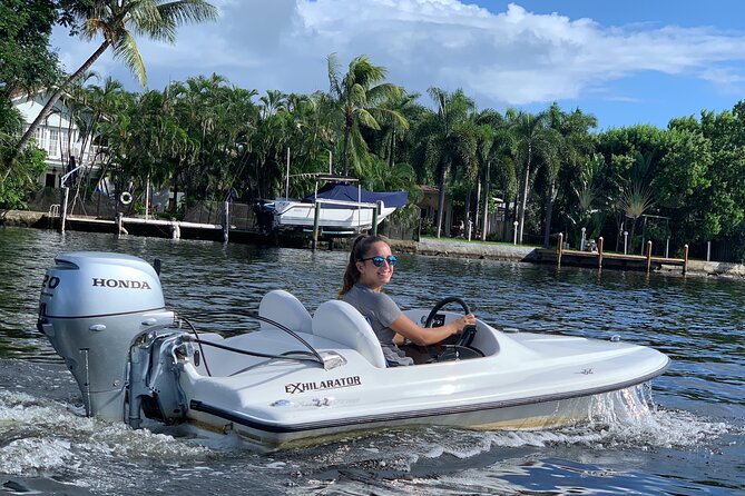 Ft. Lauderdale Mini Powerboat Rental. Canal, Yacht, Mansion Tour - Taking the wheel at Las Olas Paddle Boards