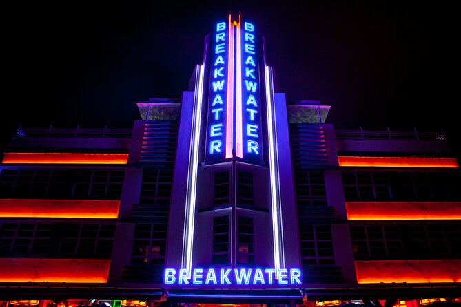 Miami Beach Bar Tour: Art Deco & Neon Lights by Local Historian - Miami Beach after dark, with the buildings switched on